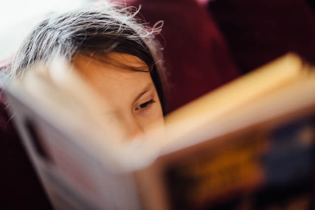 johnny-mcclung-RjdoQxJ7-5k-unsplash boy reading