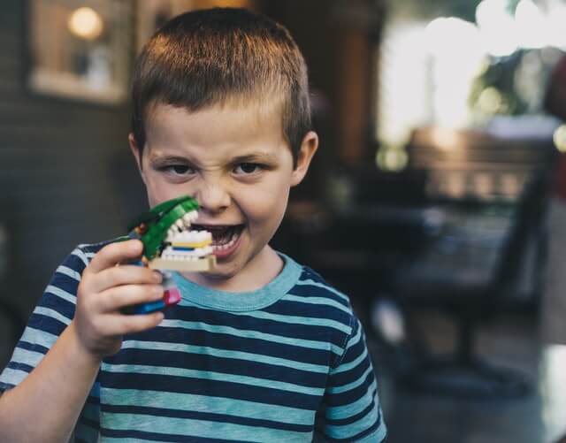 Roaring boy with toy Roaring boy with toy